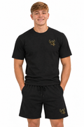 Charlie in gym T-shirt and shorts, upper-leg crop