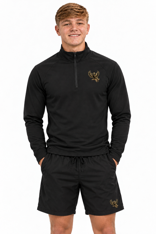Charlie in quarter-zip gym top and shorts, upper-leg crop
